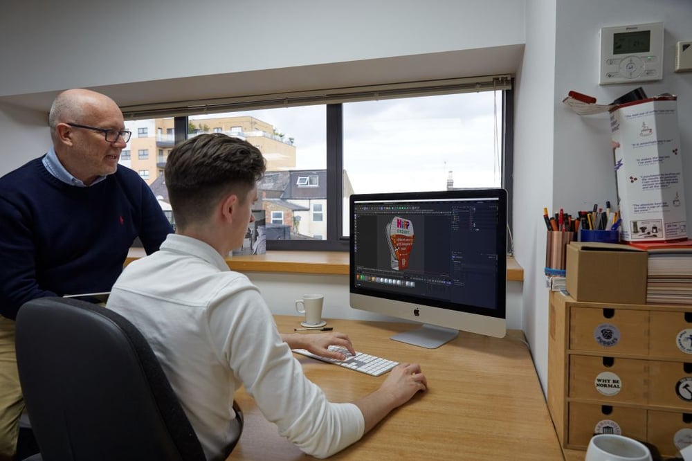 workstation, of Luke designing a HiPP packaging on a laptop 