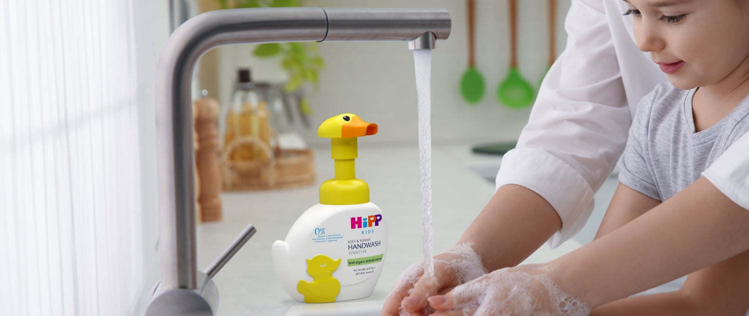 Little girl washing her hands with HiPP kids duck handwash