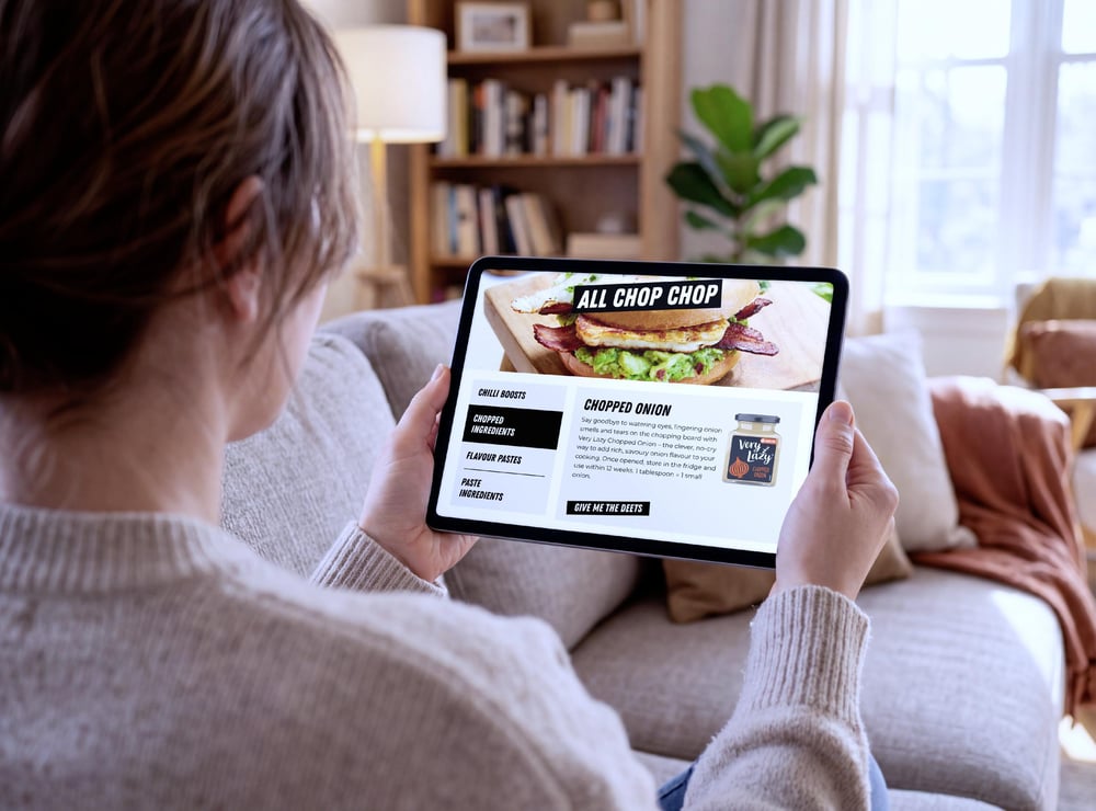 women holding a ipad looking at english provender products
